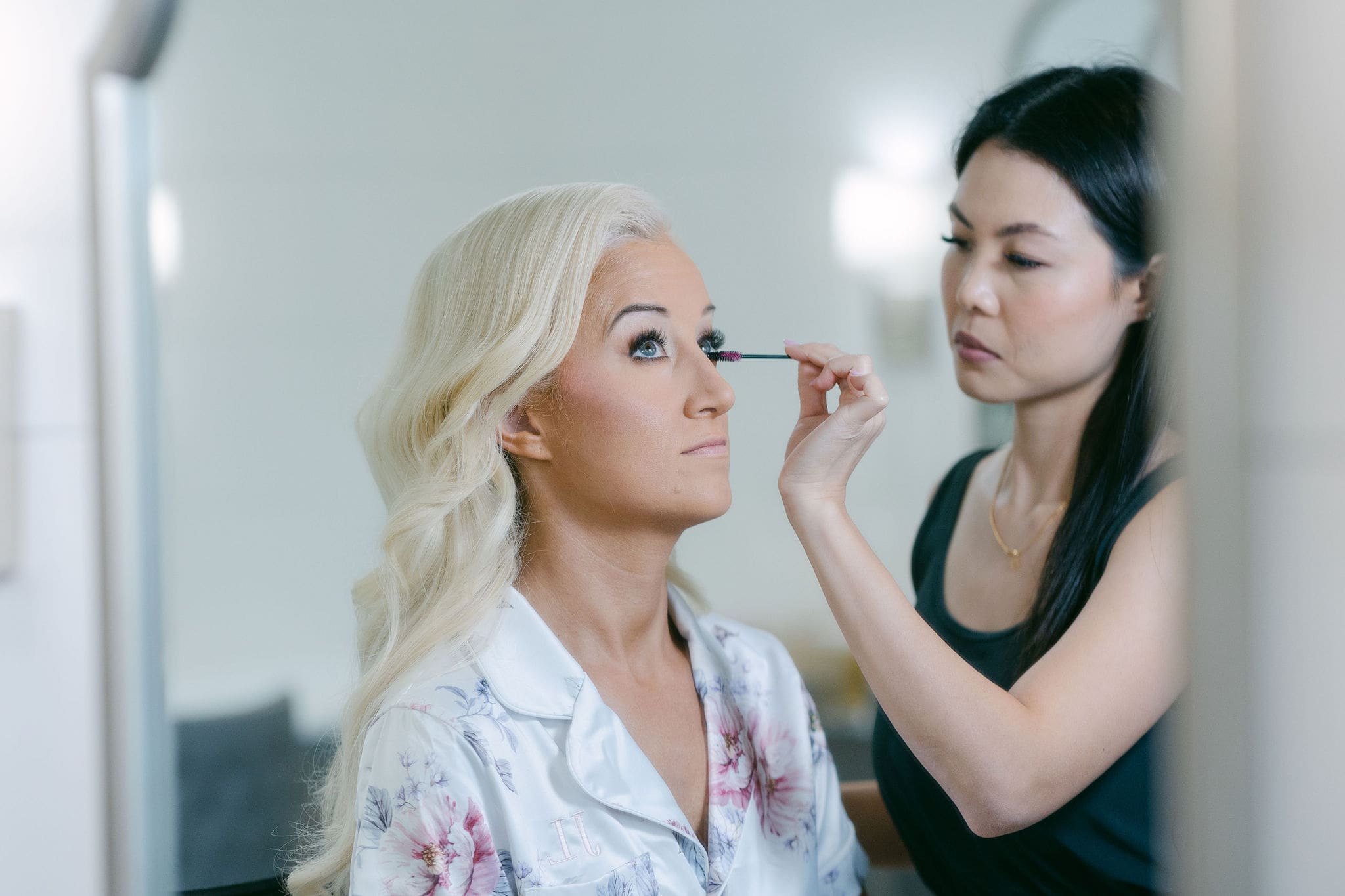 Bride getting hair and makeup done
