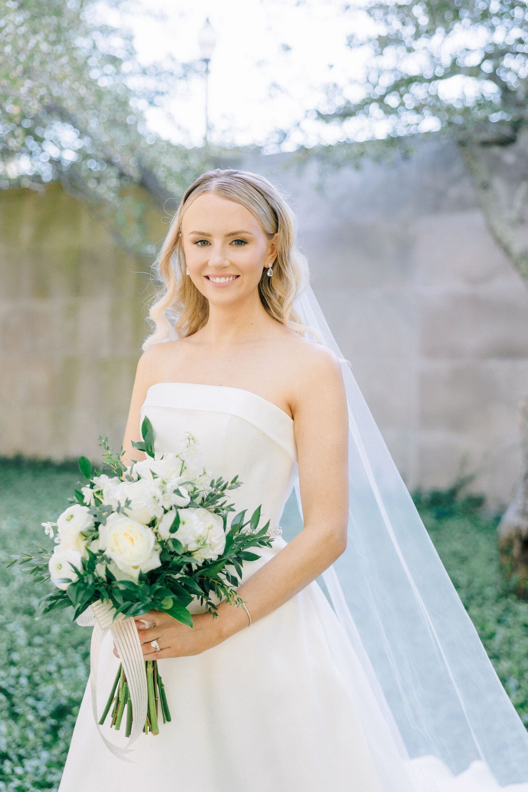 Windy City Glam client bride in her wedding gown holding a bouquet.