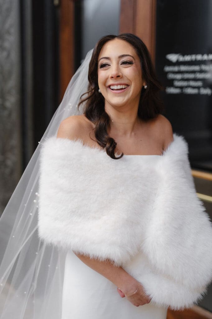 Happy bride wearing white gown