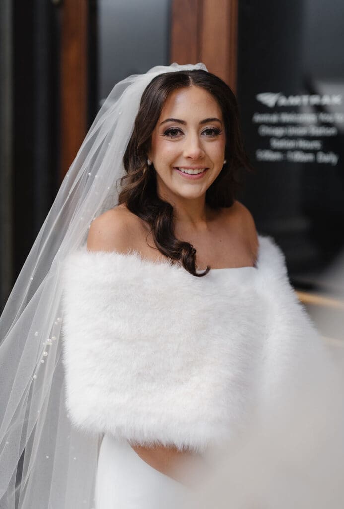 Bride wearing white fur coat