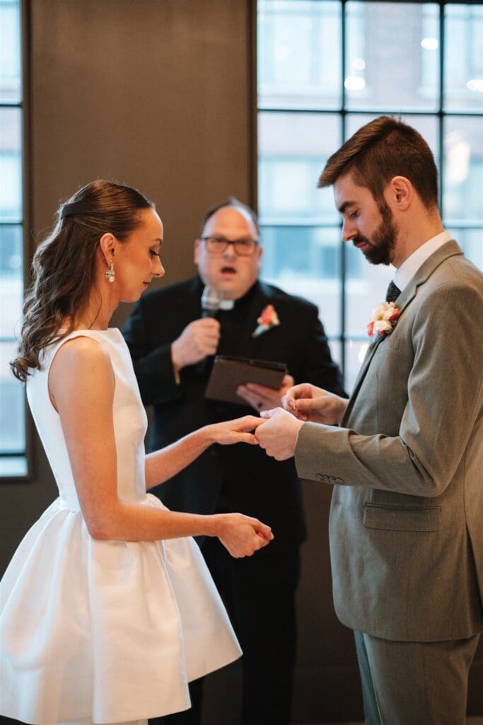 Bride and Groom exchanging rings