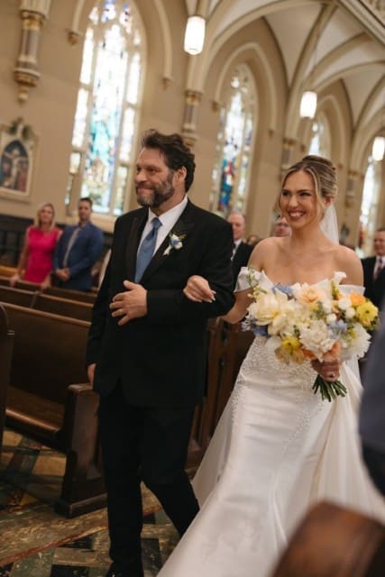 Bride with her father walking down the aisle.