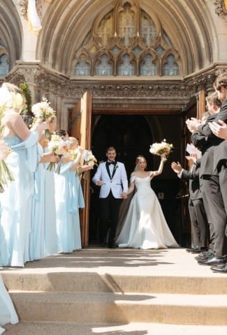Bride and Groom kissing outside the church.