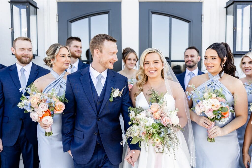 Bride and groom walking down the aisle holding hands