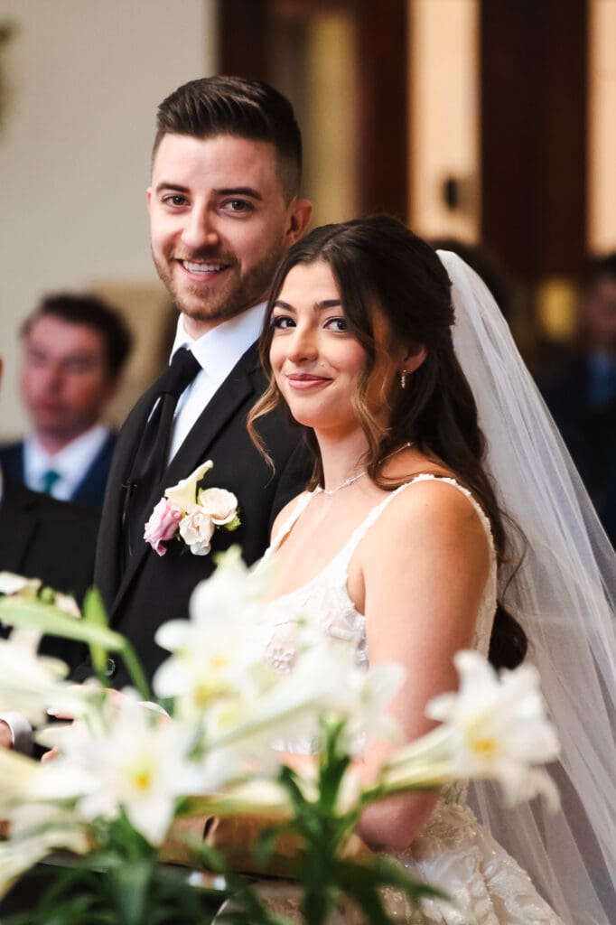 Bride and groom posing for a photograph.