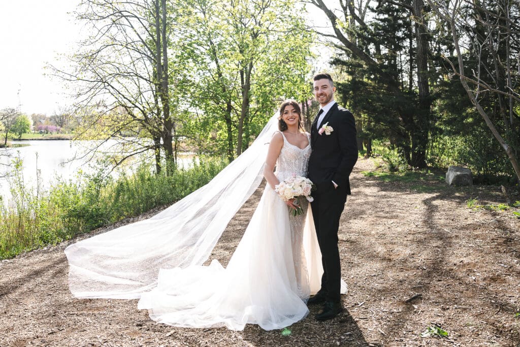Bride and groom posing for a picture.