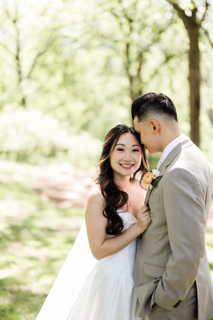 East Asian bride and groom posing for a portrait
