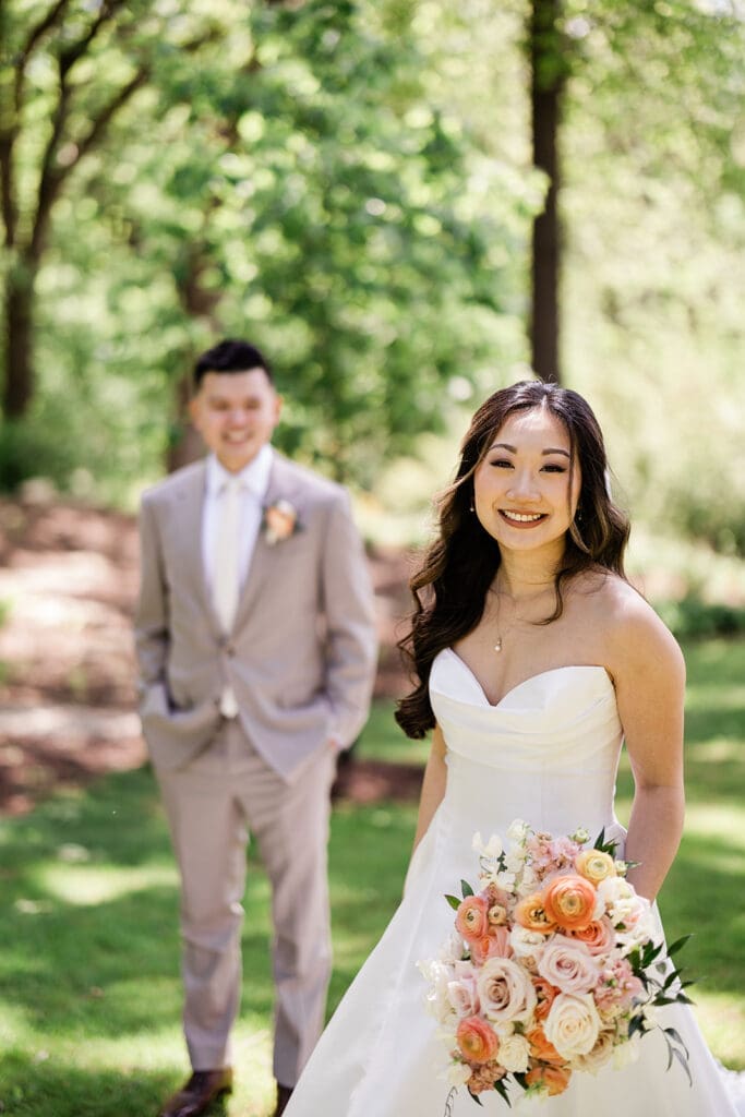 East Asian bride and groom posing for a portrait