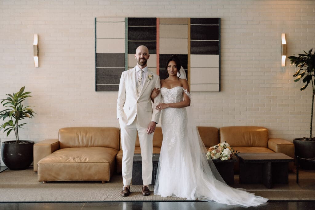 Bride and groom standing.