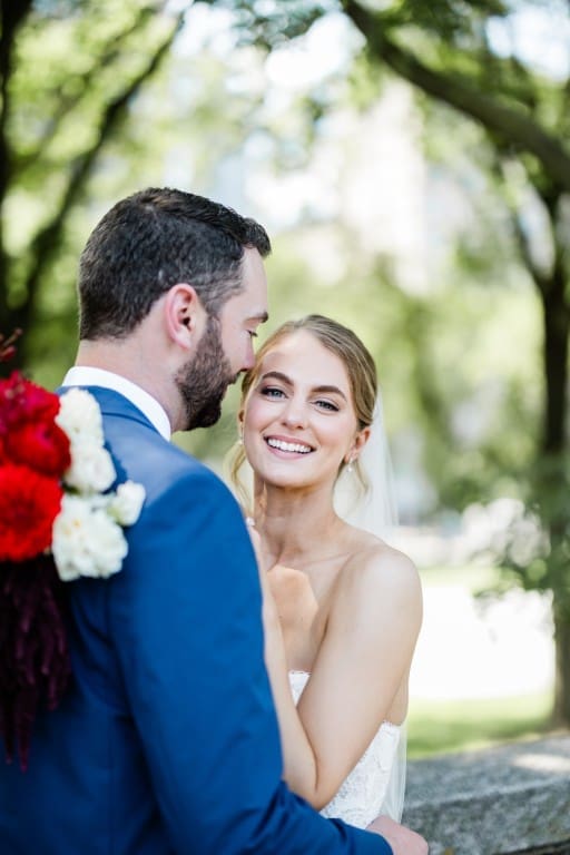 Bride and groom posing and smiling.