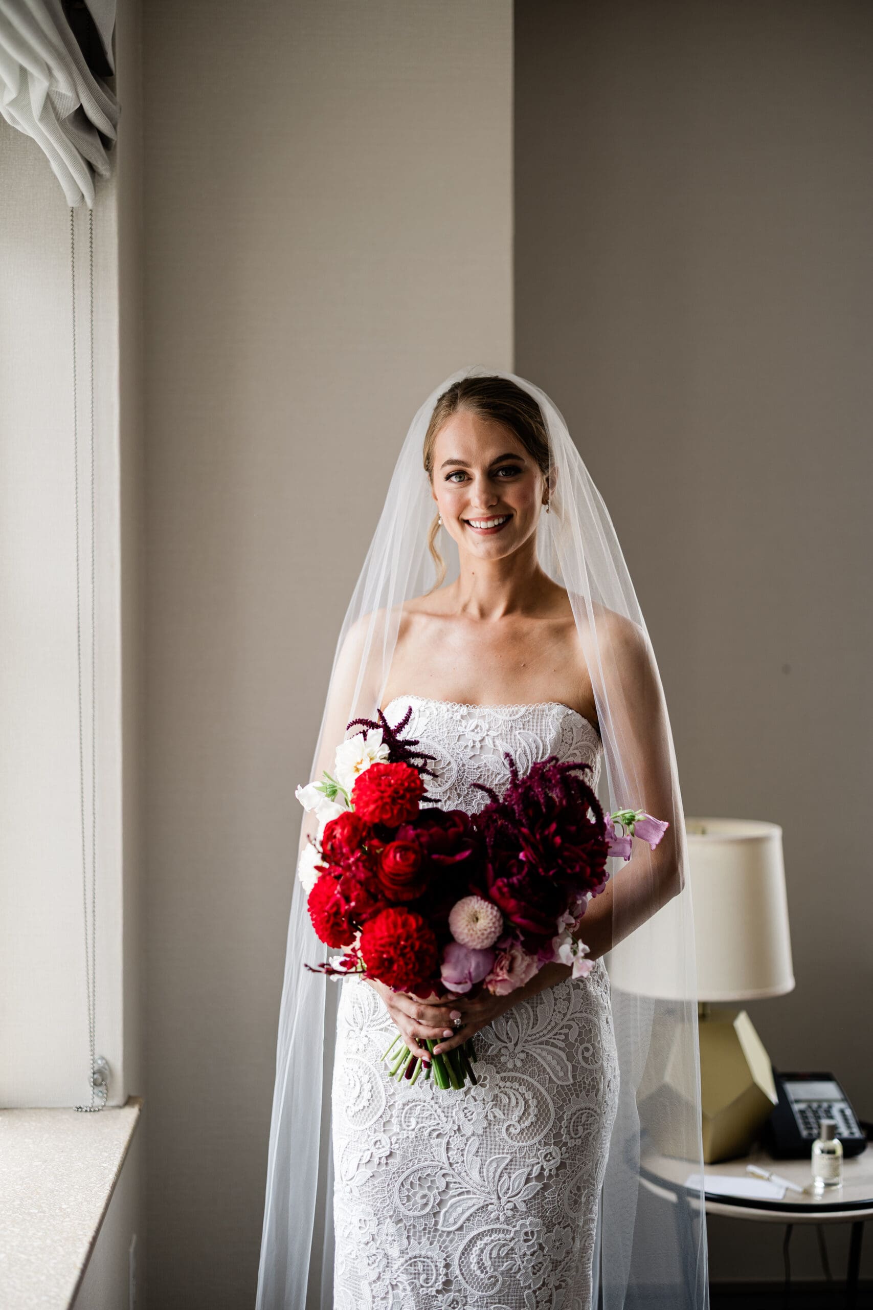 Bride wearing a veil and holding a bouquet