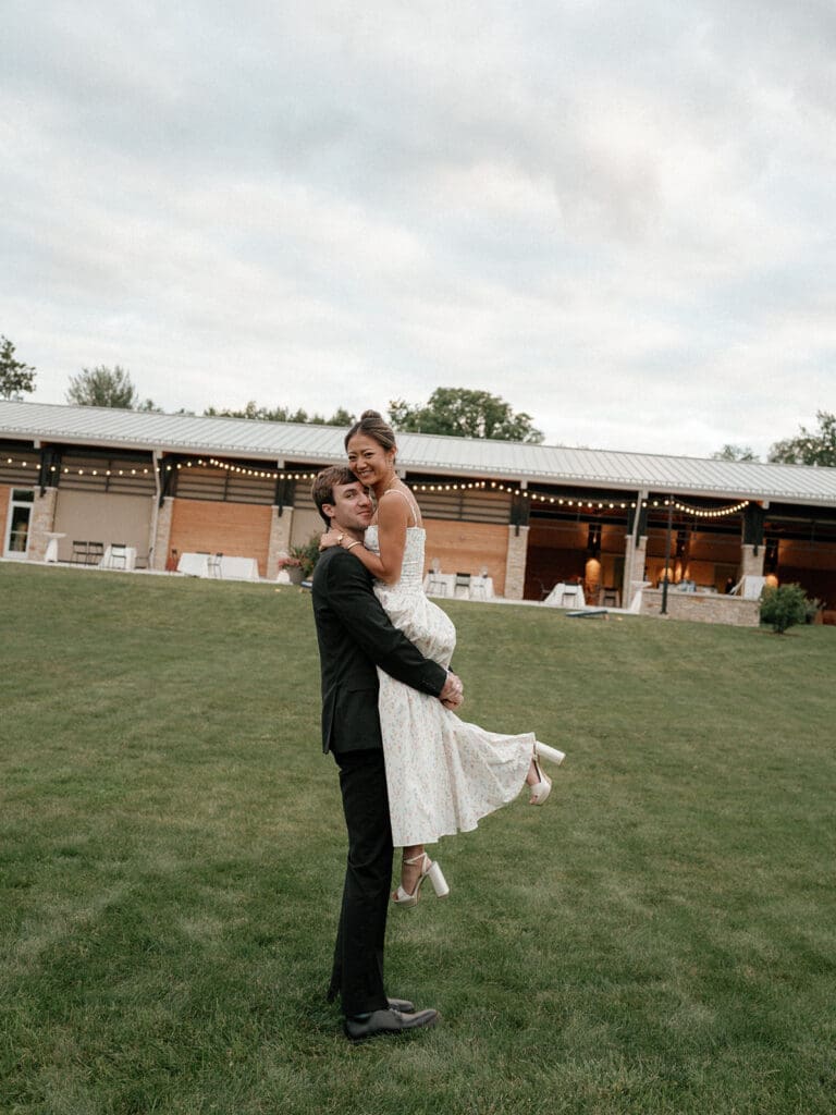 Groom carrying the bride.