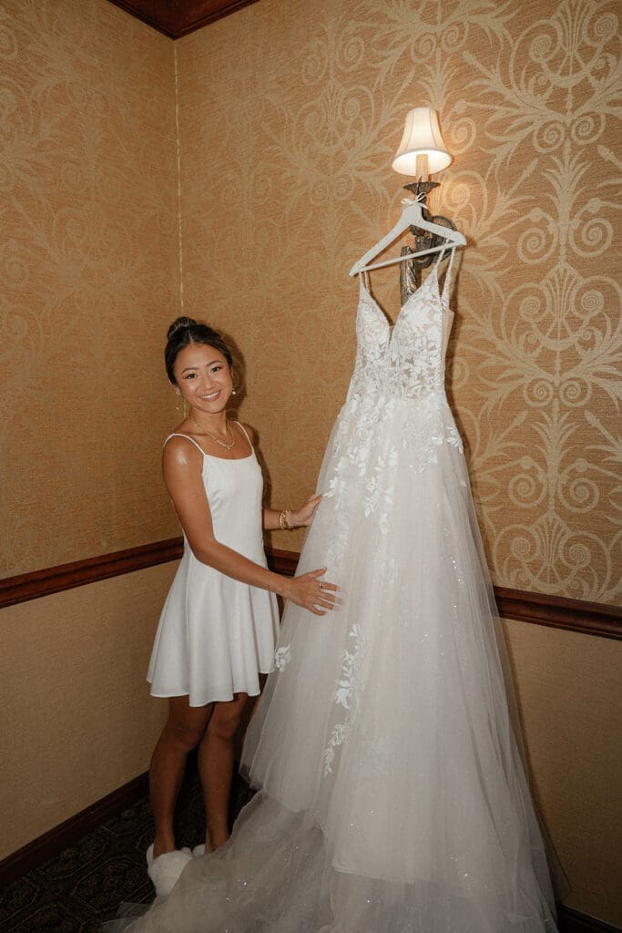 Bride holding her dress. 