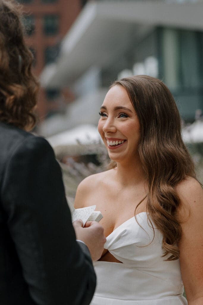 Bride smiling with her groom.