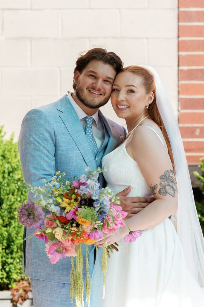 Happy bride and groom smiling together.