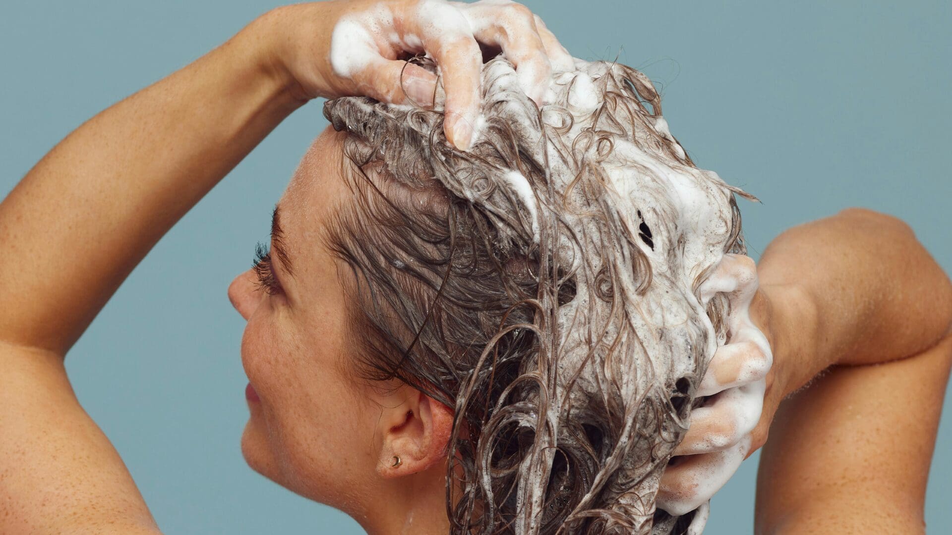 Woman shampooing her hair