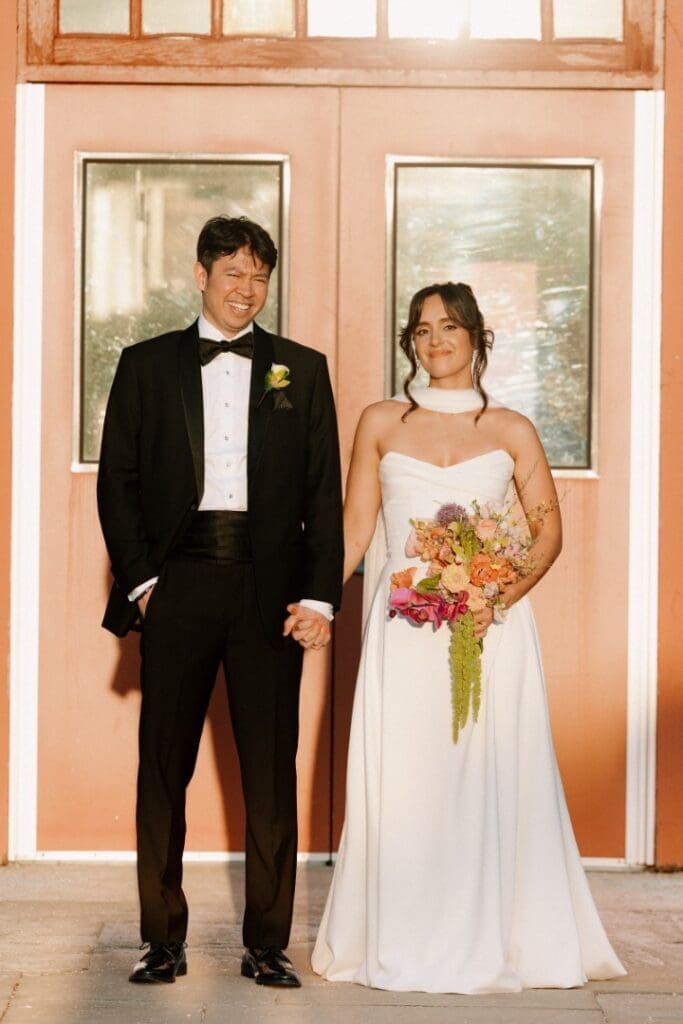 Chicago bride wearing an updo posing with her groom