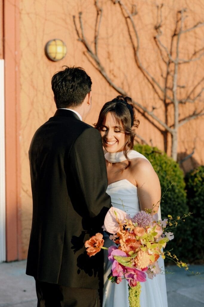 Chicago bride wearing an updo posing with her groom