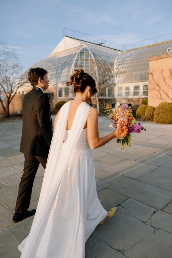 Chicago bride wearing an updo walking with her groom
