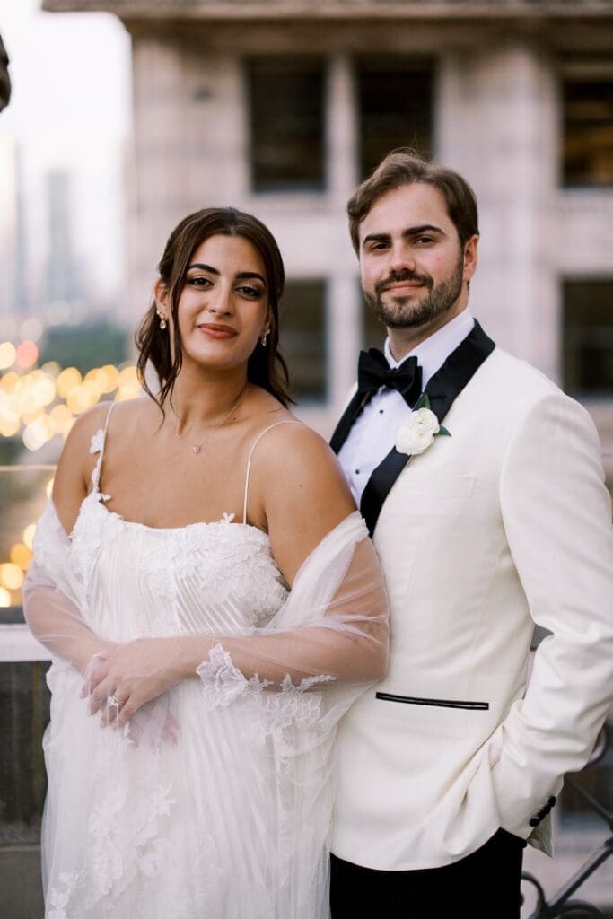 Chicago bride with soft glam makeup and hair down posing with the groom