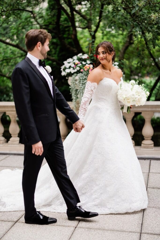Chicago bride and groom holding hands walking down the aisle