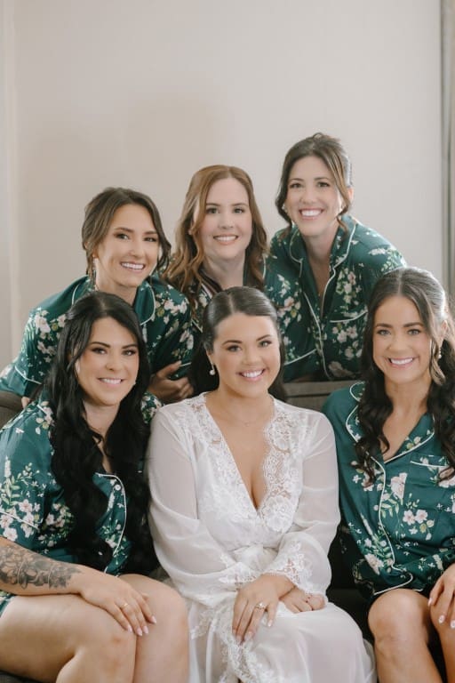Bride and her bridesmaids smiling