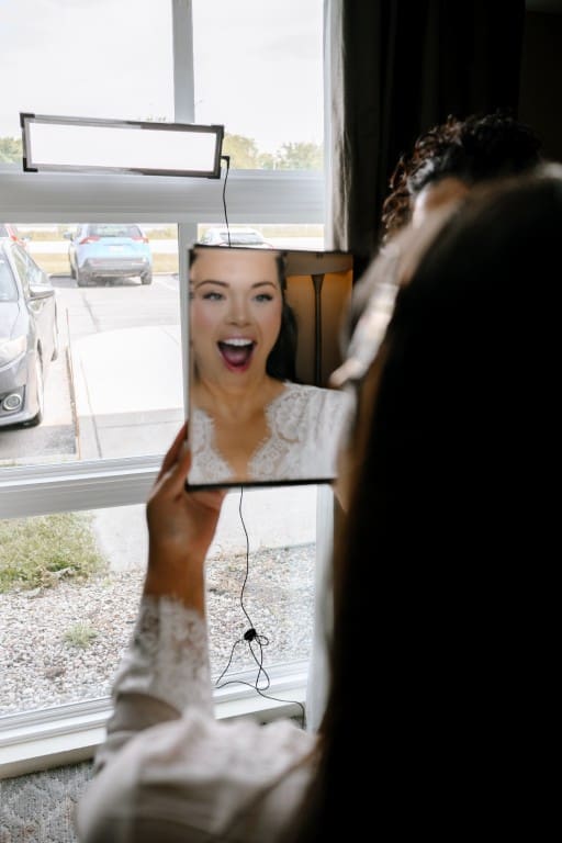 Bride excited looking at the mirror