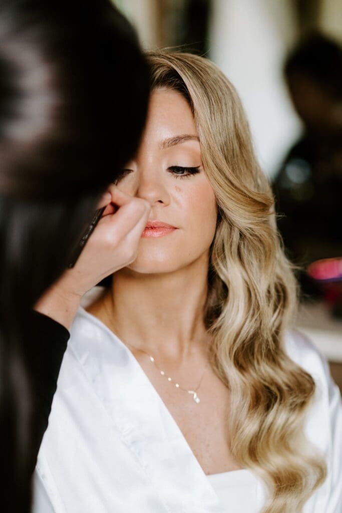 Bride getting makeup