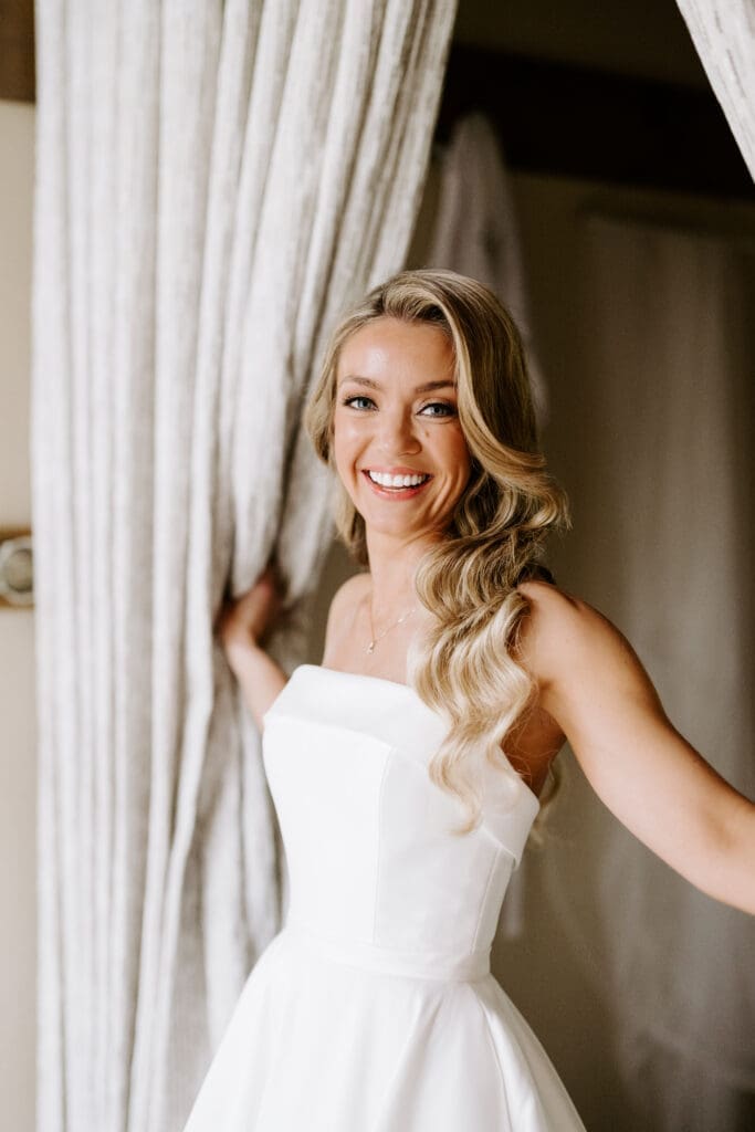 alt="Bride with soft glam makeup and radiant bridal beauty look"