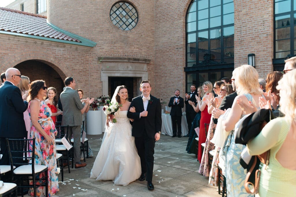 Bride and groom walking down the aisle