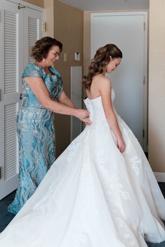 Bride with her mom dressing up