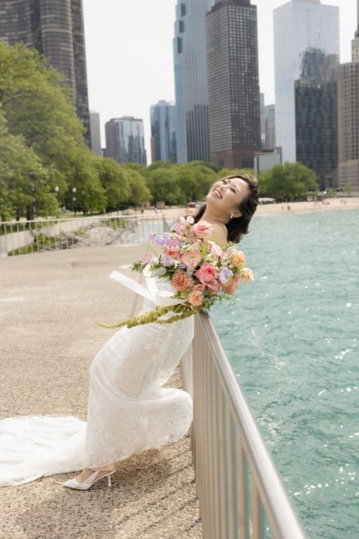 Chicago bride smiling holding a bouquet.
