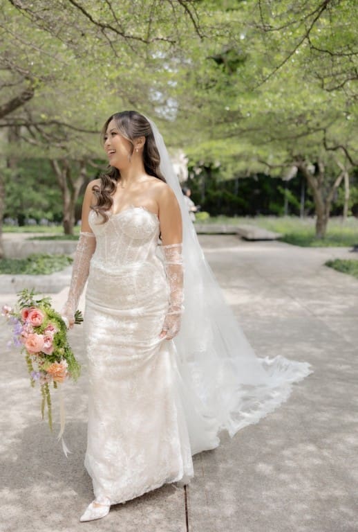 Chicago bride smiling holding a bouquet.