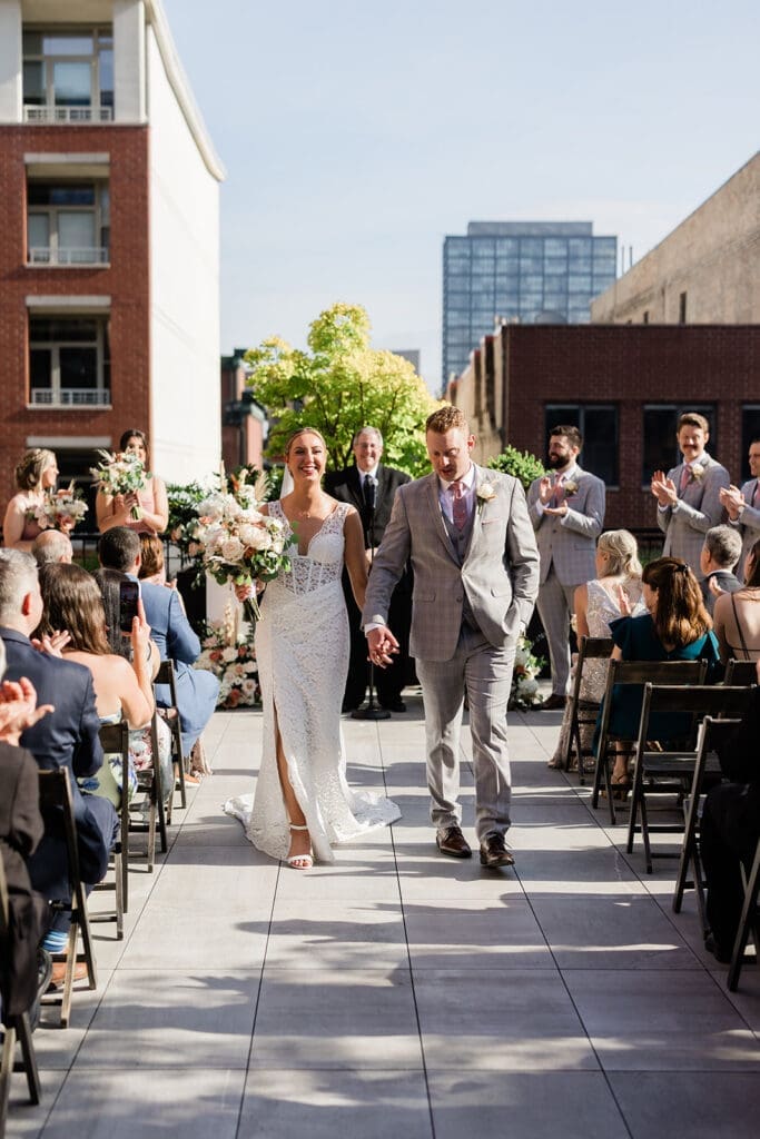 Chicago bride and groom walking at the aisle