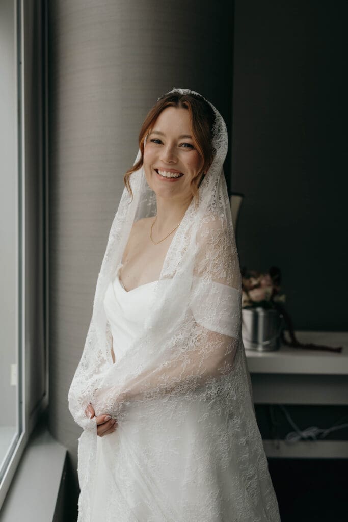 Sophia's wedding day featured soft glam makeup, a modern updo, and a classic veil, creating an elegant bridal look that felt polished and timeless.