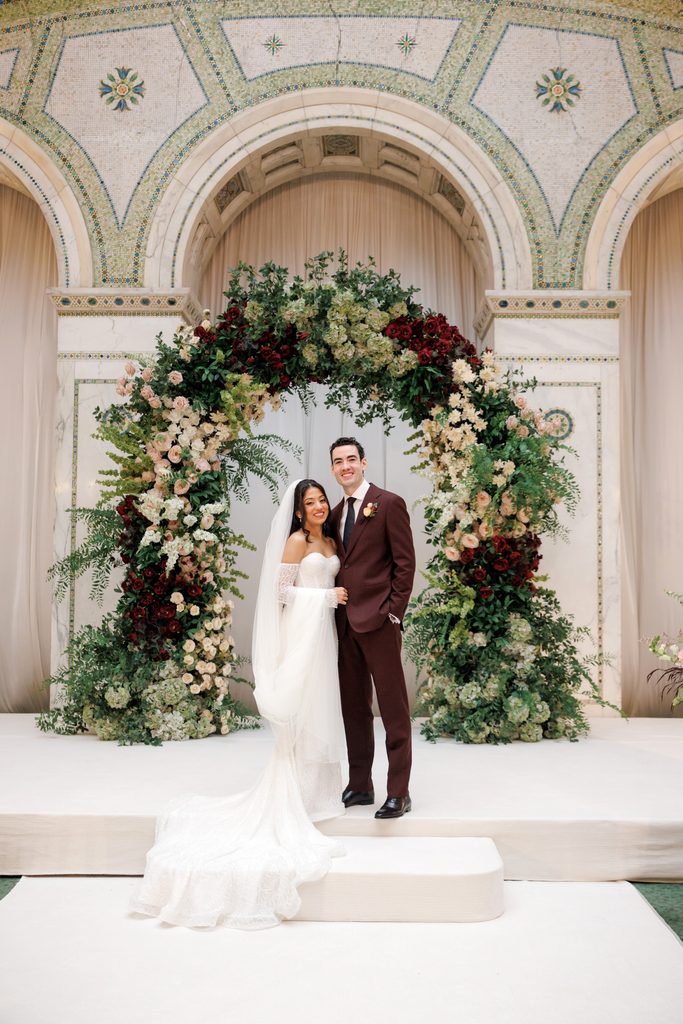 Indian bride and groom pose for camera.
