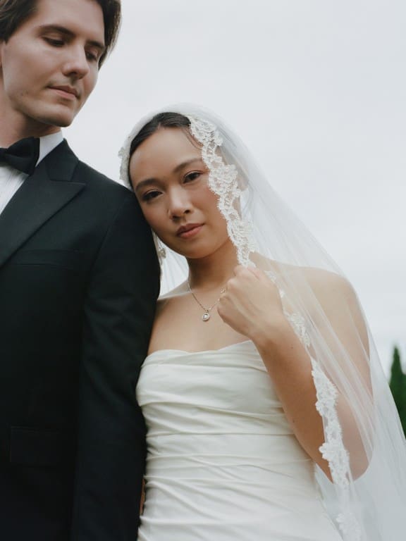 Asian bride in soft glam wearing veil